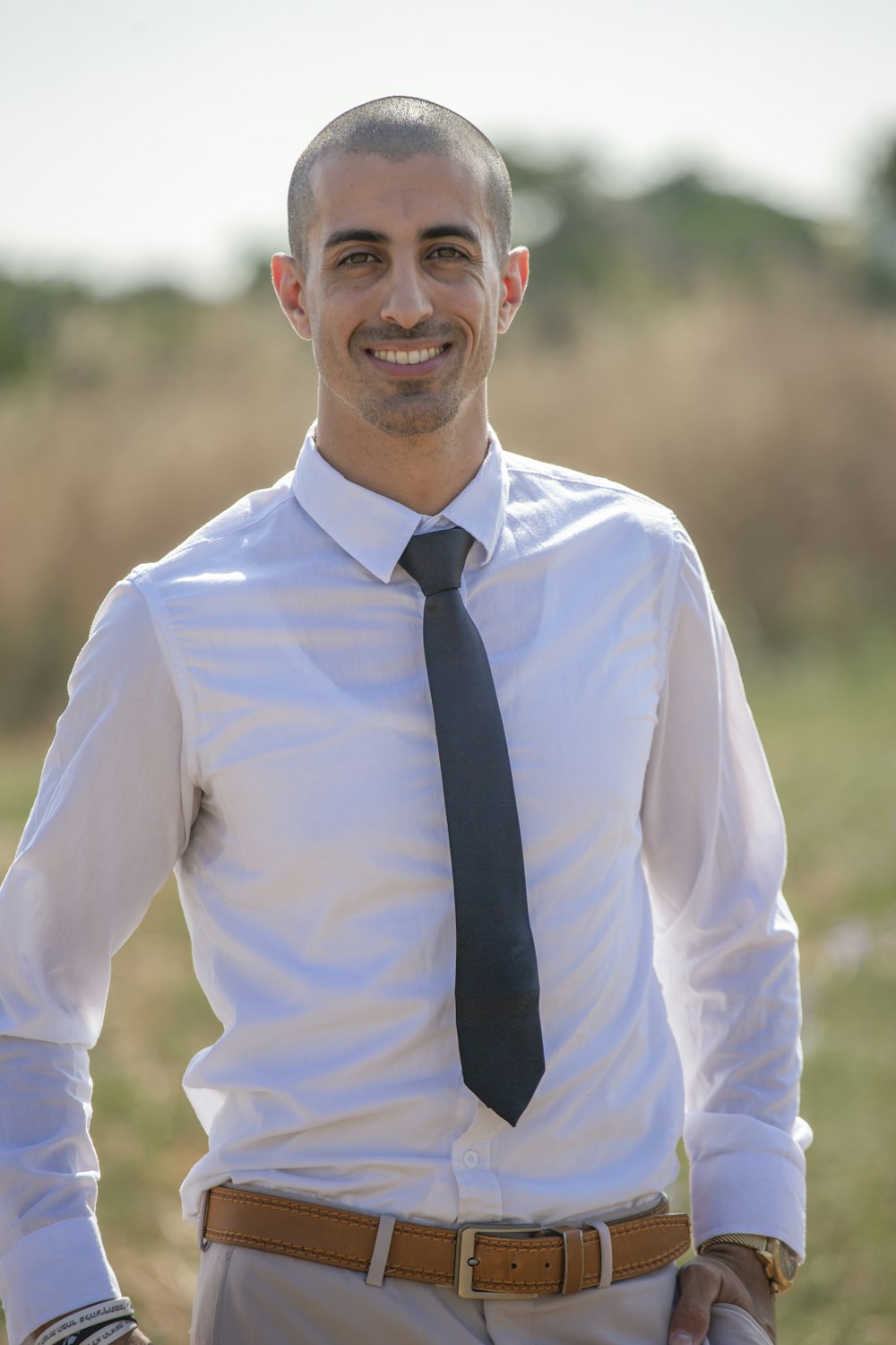 man in white dress shirt and black necktie