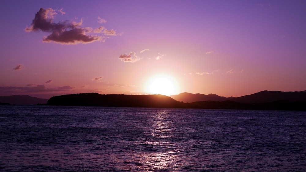 body of water during sunset