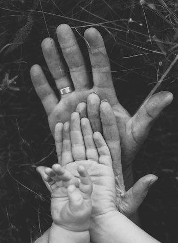 grayscale photo of persons hand