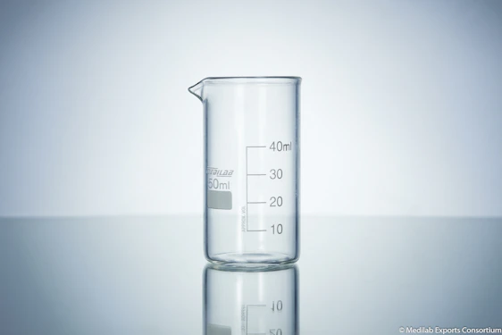 Close-up of a skilled technician inspecting a clear borosilicate glass beaker in a bright laboratory.