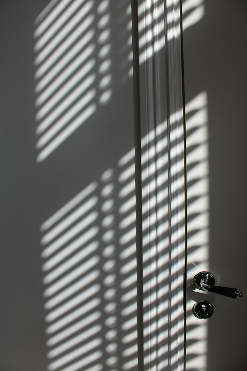 white wooden door with silver door lever