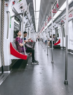 Close-up of a sleek train interior with passengers seated.