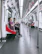 Passengers enjoying comfortable seating inside a modern train carriage.