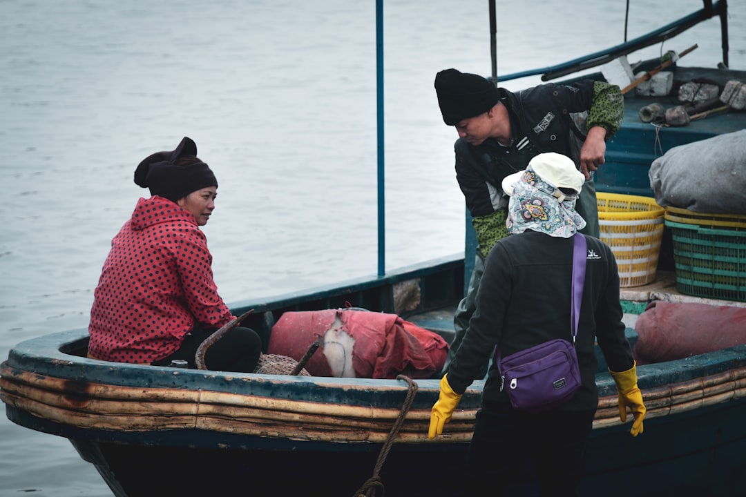 people riding on boat during daytime