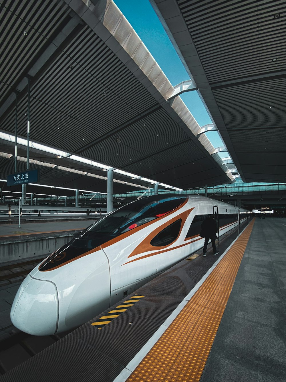 white and black train on train station