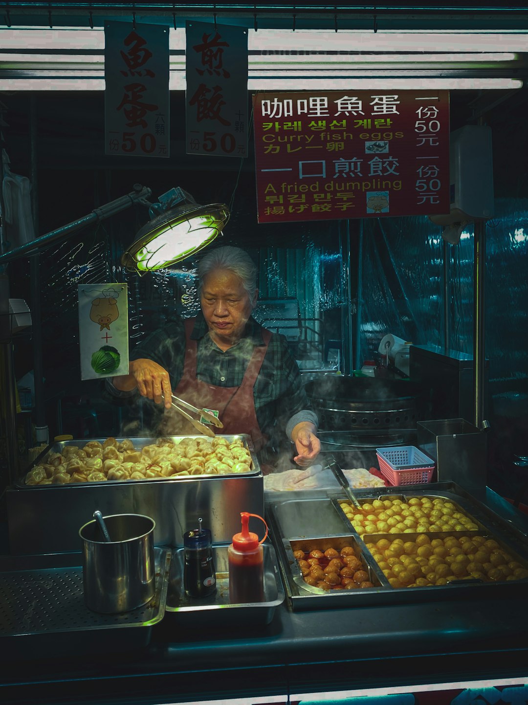 man in brown jacket cooking food