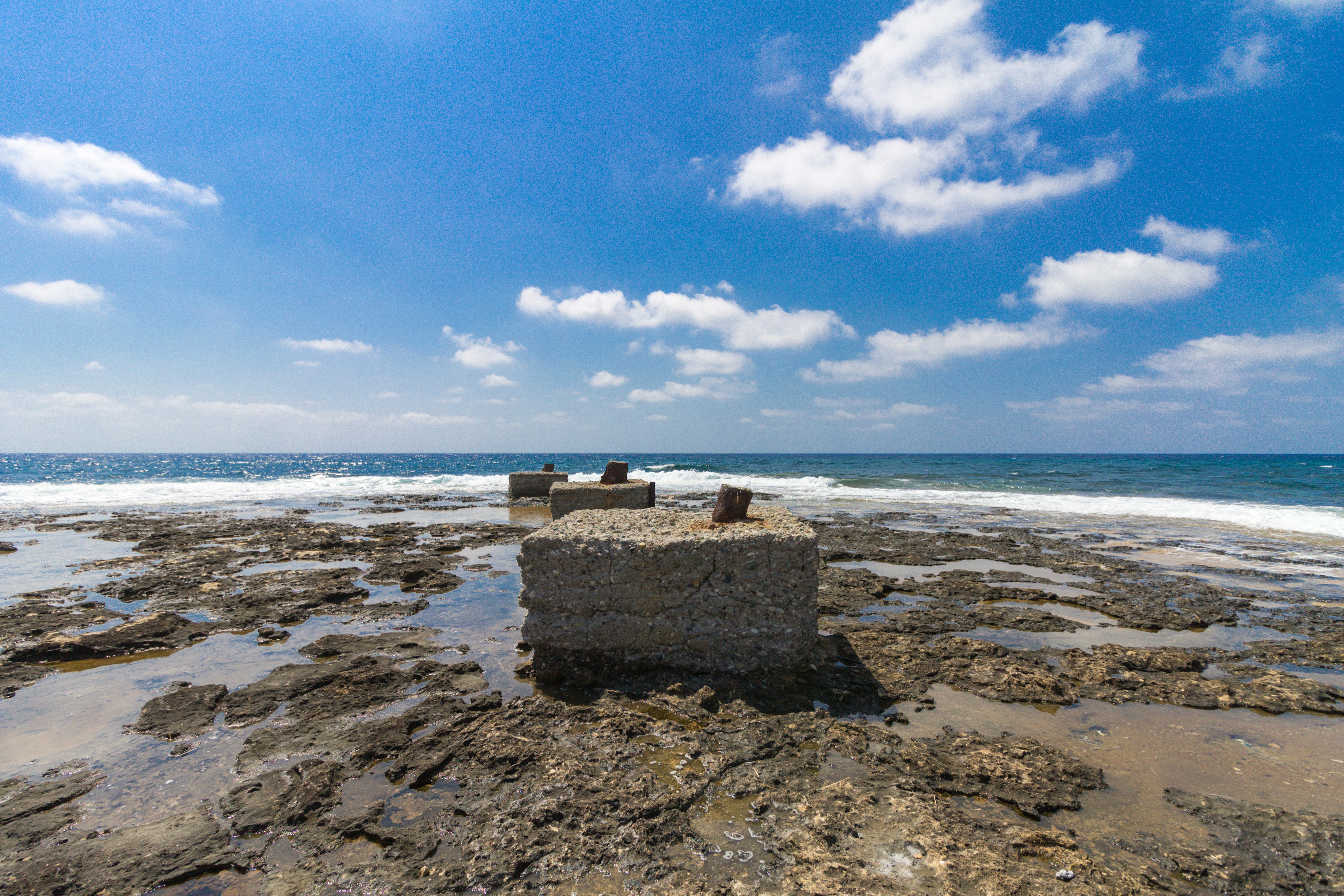 brown rock on seashore during daytime