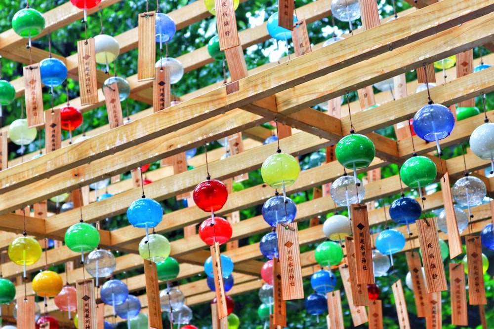 multi colored balloons on brown wooden rack