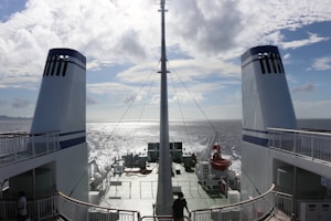 blue and white ship on sea during daytime