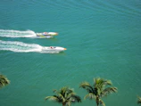 Young friends racing water karts under the turquoise sky at Waterkart base.