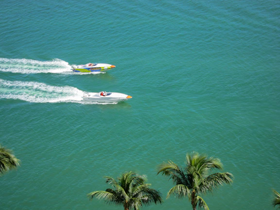 Young friends racing water karts under the turquoise sky at Waterkart base.