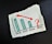A bar chart on a piece of torn paper displays data for the years 2018 through 2021. The bars representing 2018, 2019, and 2020 are colored in green and show a declining trend. A red arrow pointing downwards extends from the top of the 2018 bar to the end of the 2020 bar. 2021 is represented by a large red question mark, suggesting uncertainty about the future data.
