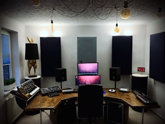 black and silver computer set on brown wooden table