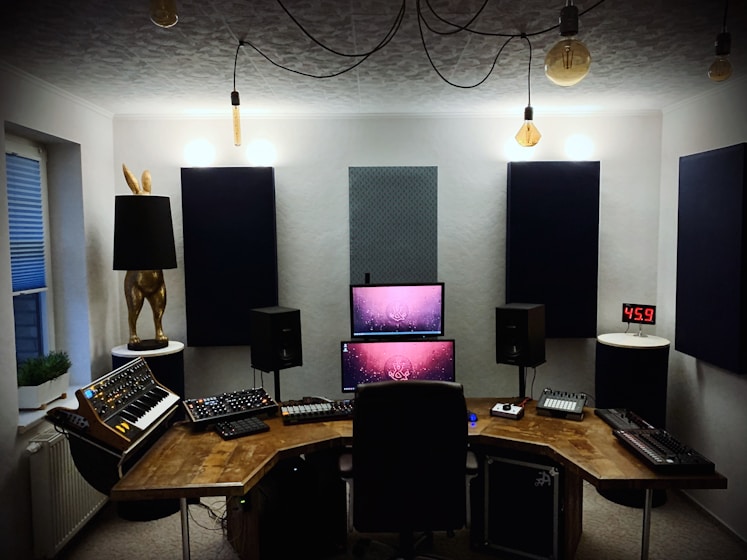 black and silver computer set on brown wooden table