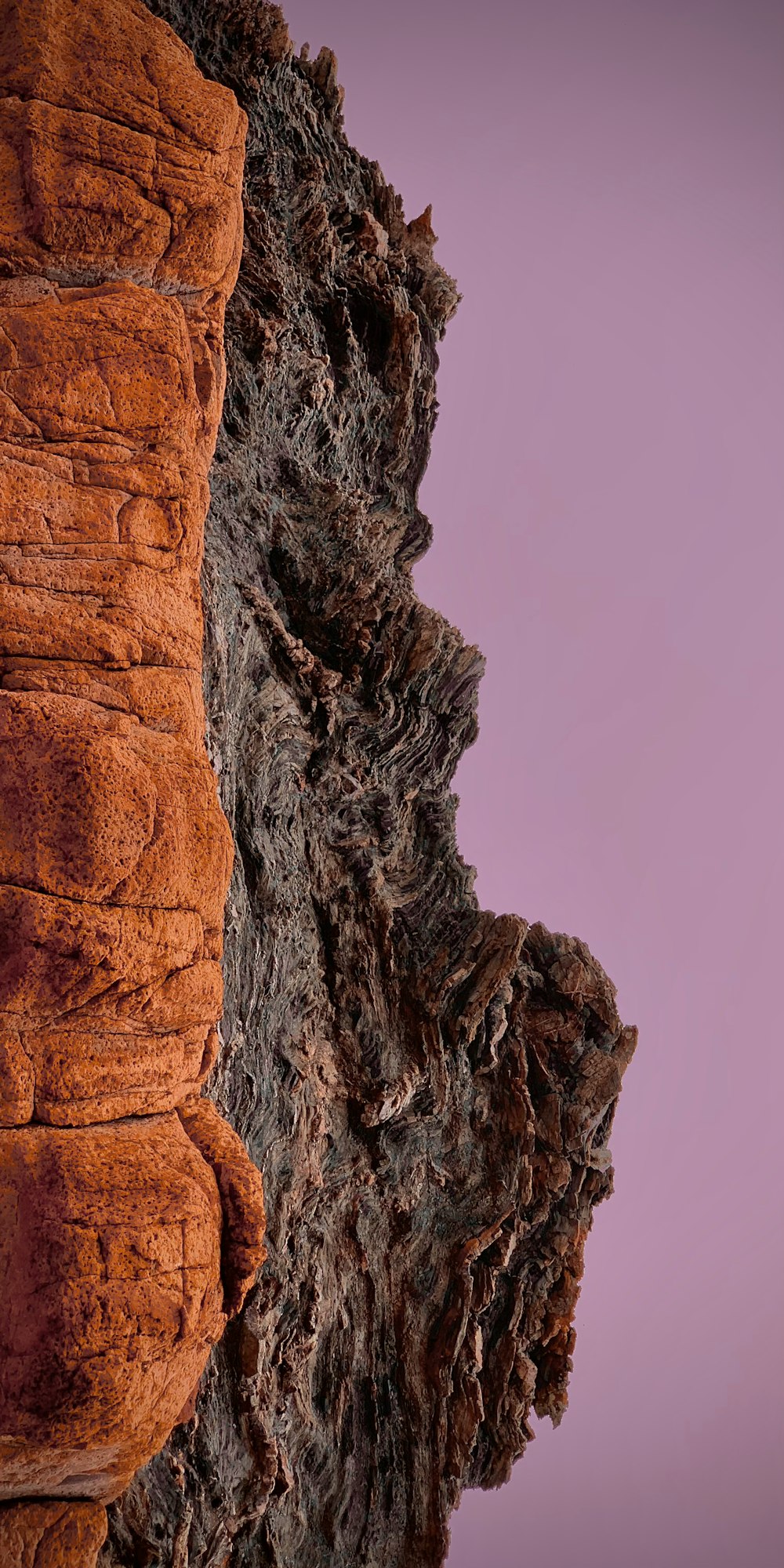 brown rock formation under blue sky