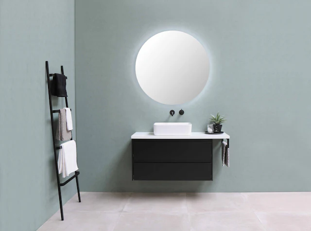 Wall Hung Vanity with Round Mirror — commercial washroom interior design