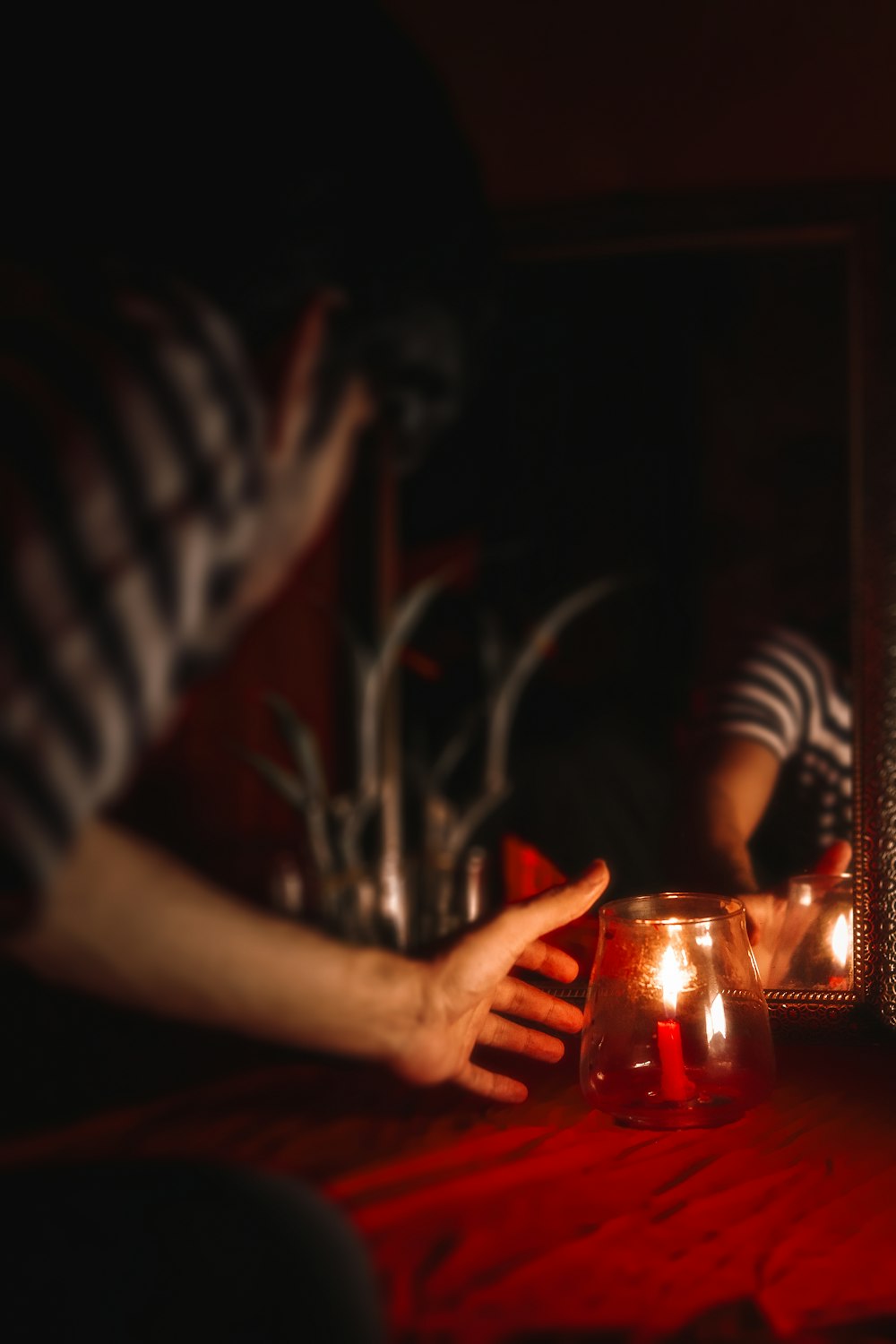 person holding clear drinking glass