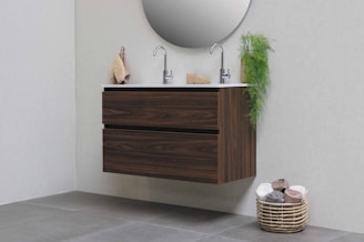 brown woven basket on white ceramic sink
