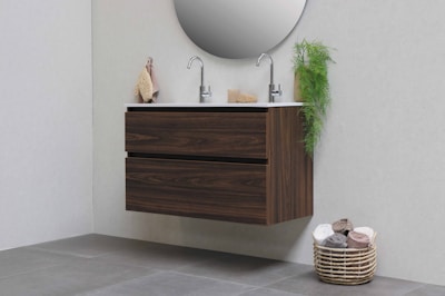 brown woven basket on white ceramic sink