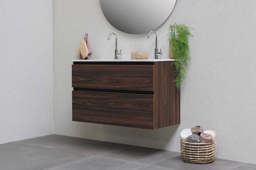 brown woven basket on white ceramic sink