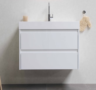 white wooden cabinet on white ceramic tiles