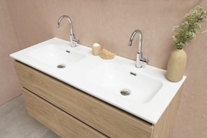 white ceramic sink with stainless steel faucet