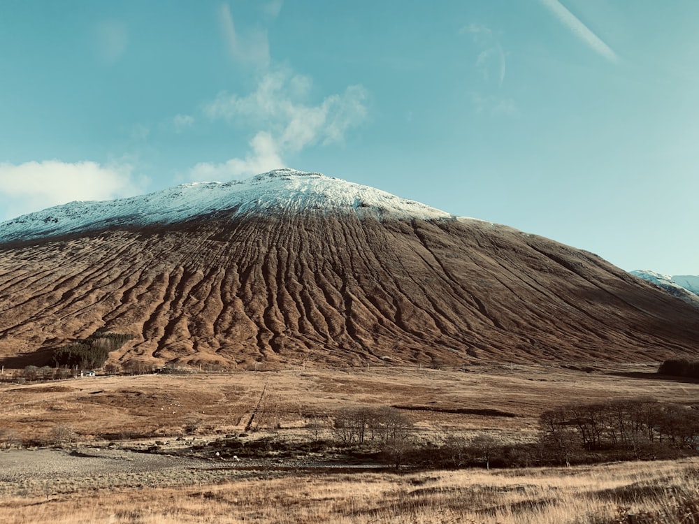 brown mountain under blue sky during daytime