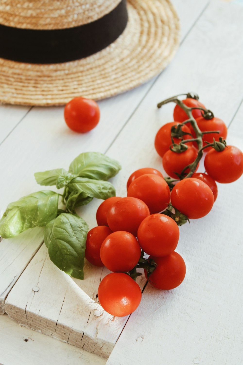 red tomatoes on white table