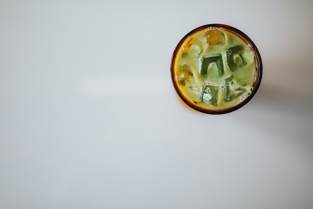 gold round ornament on white surface