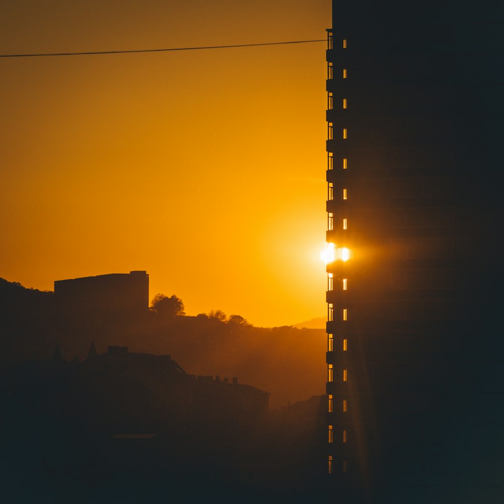 silhouette of building during sunset