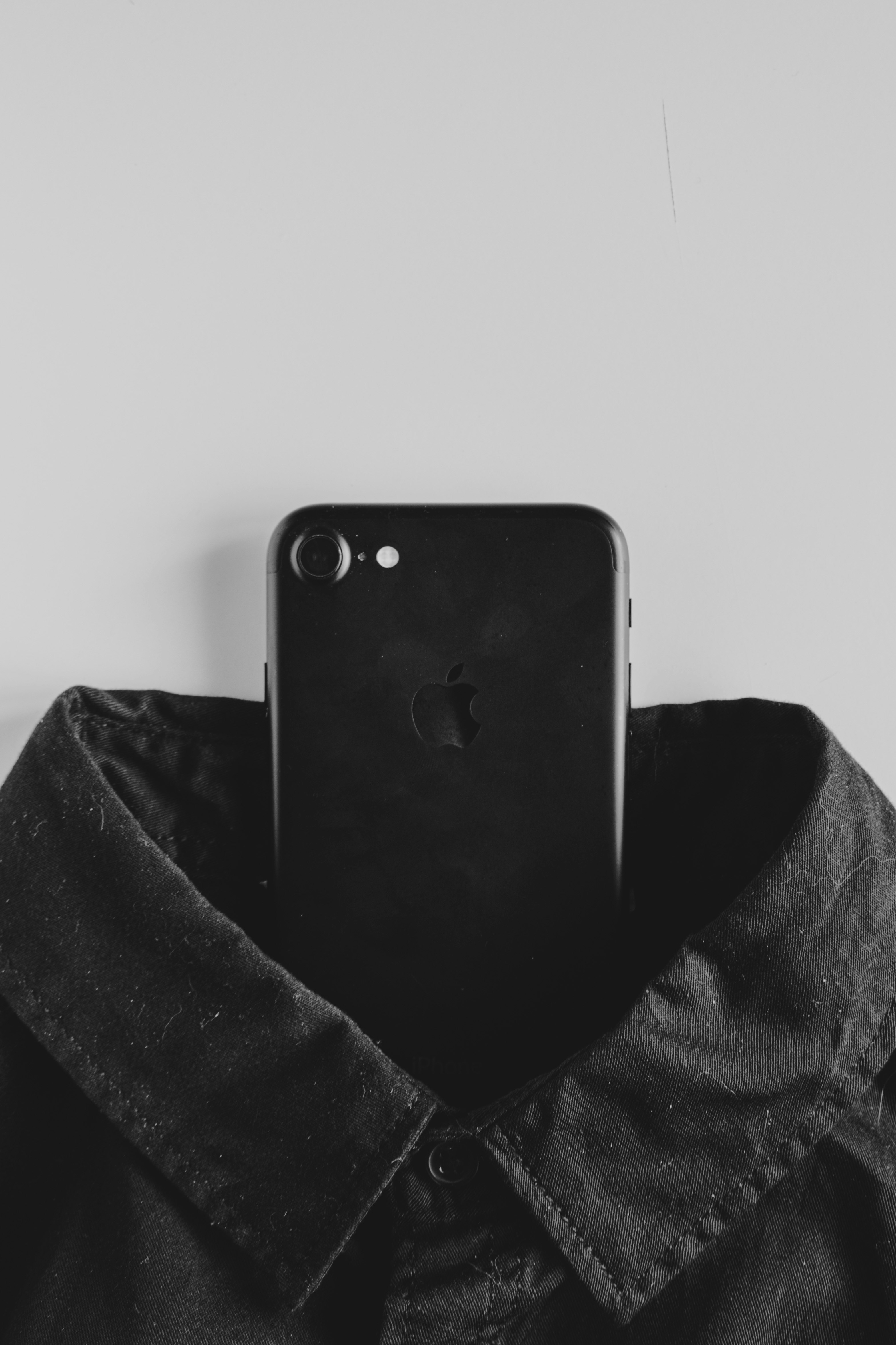 black iphone 4 on black textile