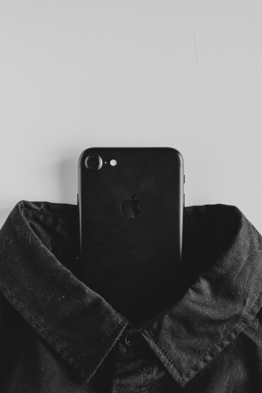 black iphone 4 on black textile