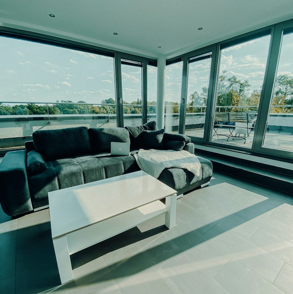 white and black sofa near glass window