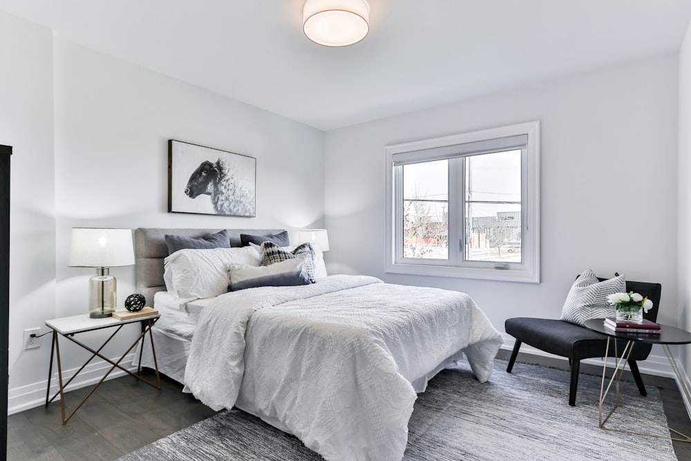 white bed linen on bed