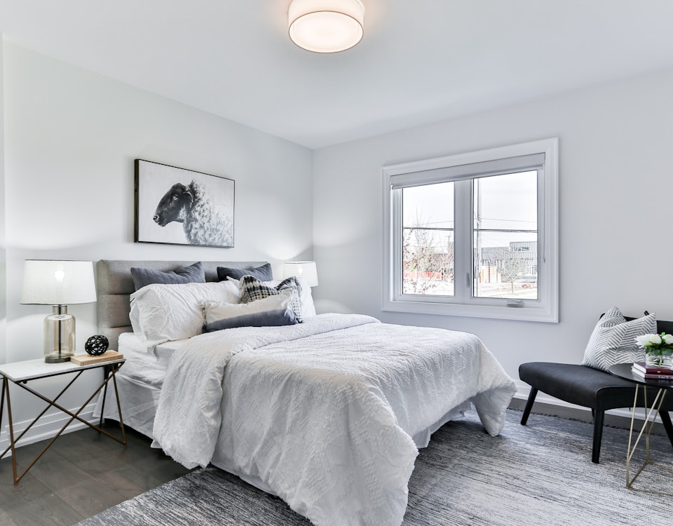 white bed linen on bed