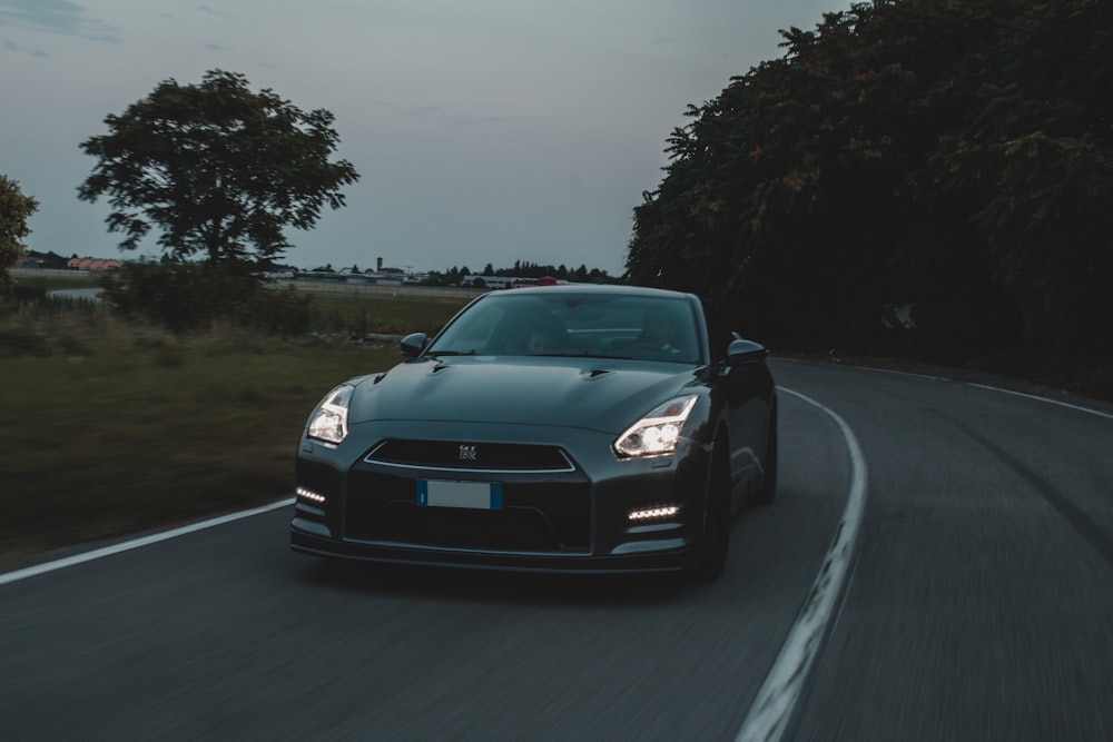 black bmw m 3 on road