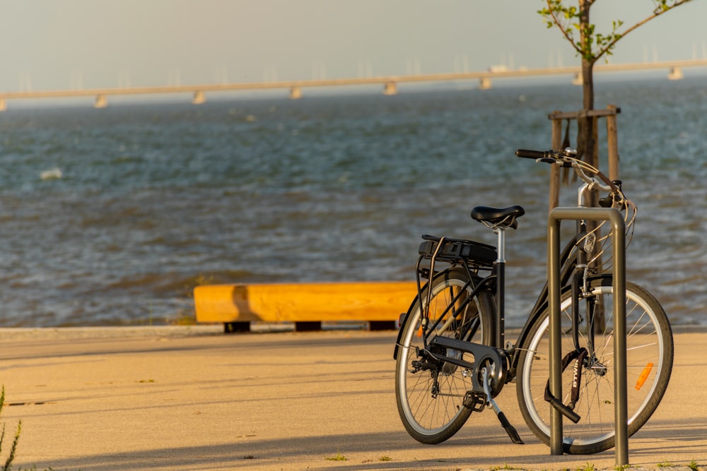 black bicycle on beach during daytime