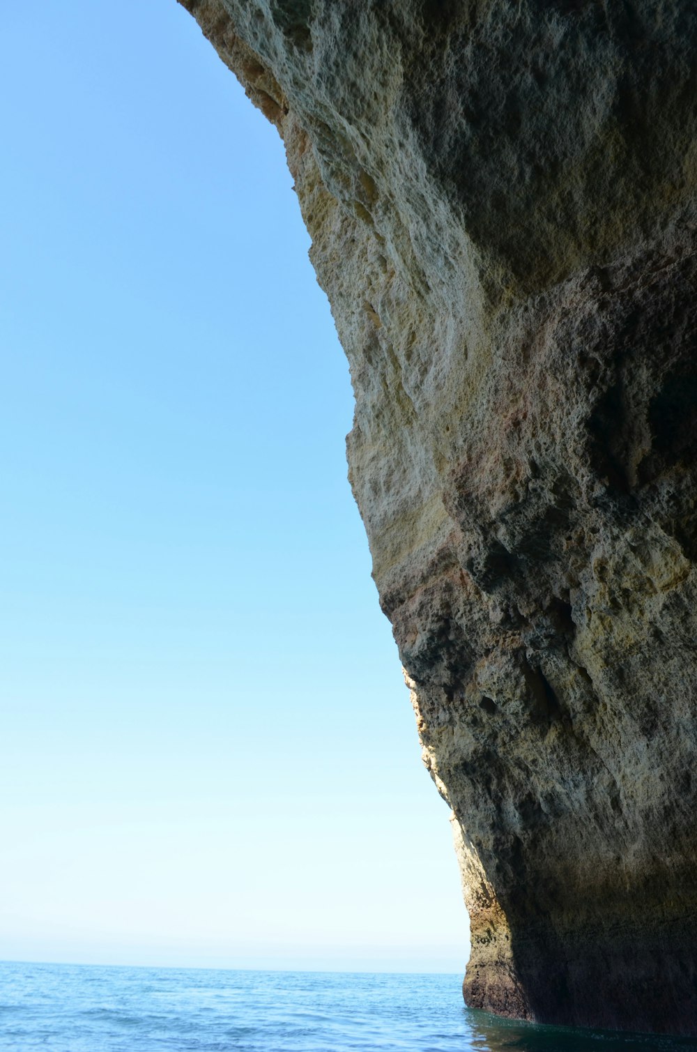 brown rock formation under blue sky during daytime