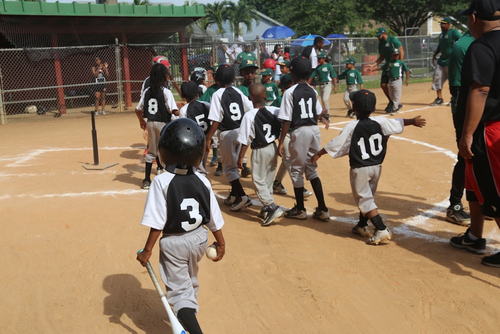 group of men playing baseball during daytime