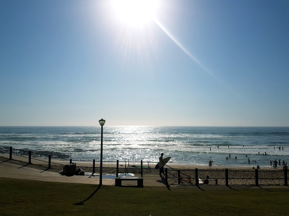 people walking on beach during daytime