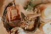 A stylish flat lay of vintage jewelry pieces on a soft beige background.