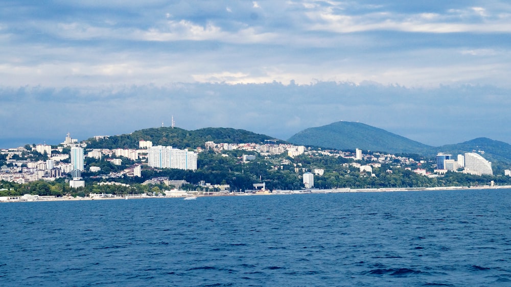 city skyline across body of water during daytime