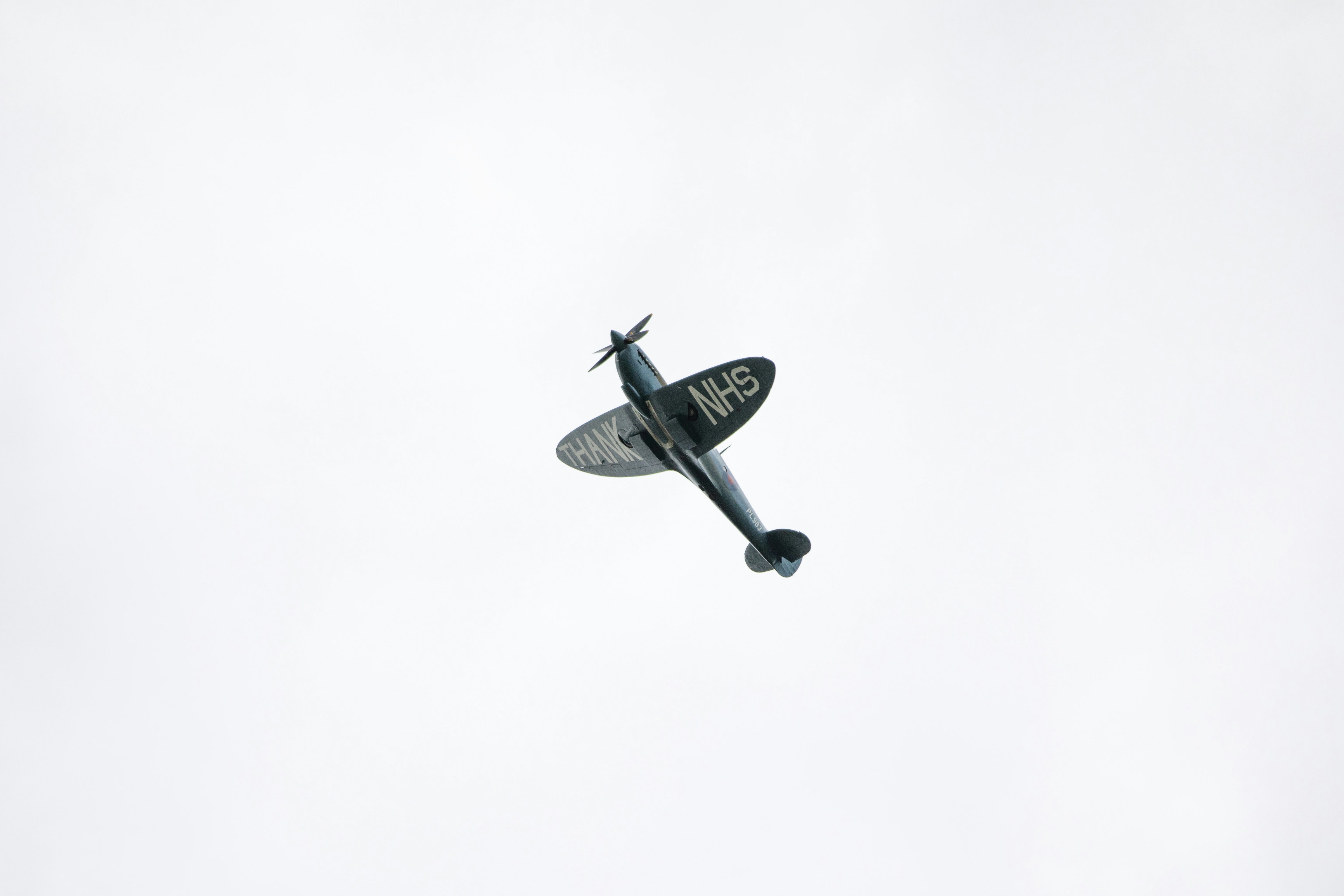 black and white airplane in mid air