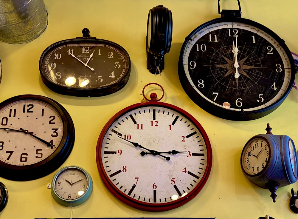 black and white analog wall clock at 10 10