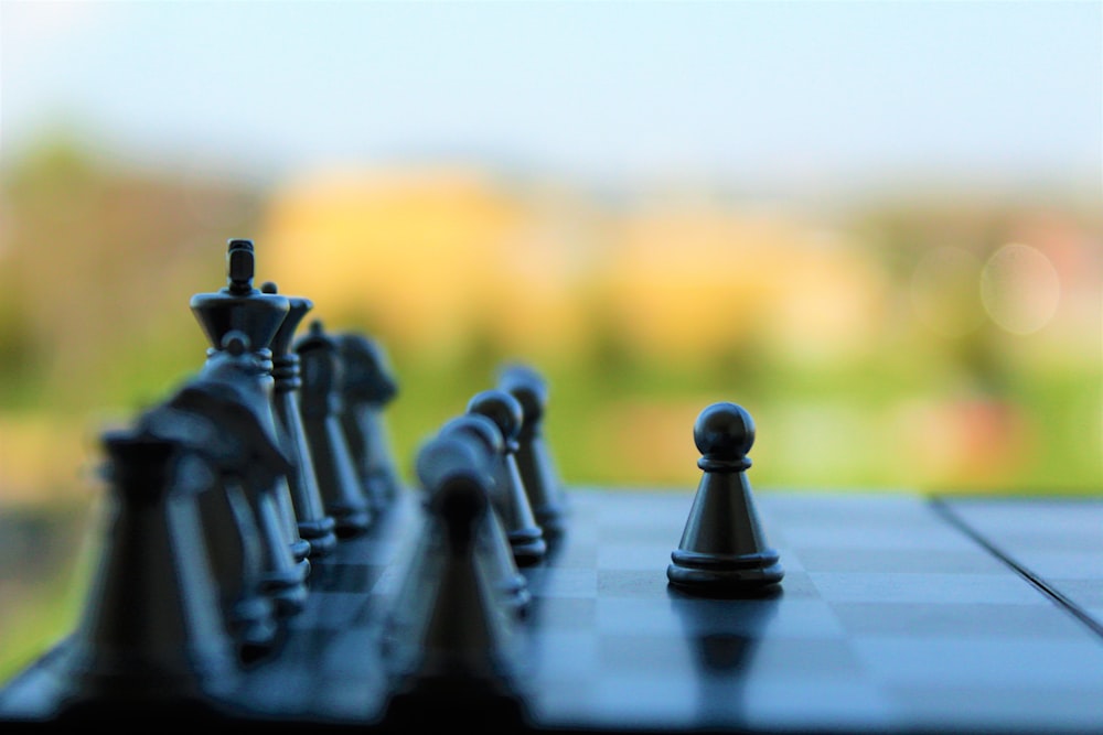 black chess piece on white table