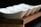 A close-up of various stylish bowls displayed on a wooden table.