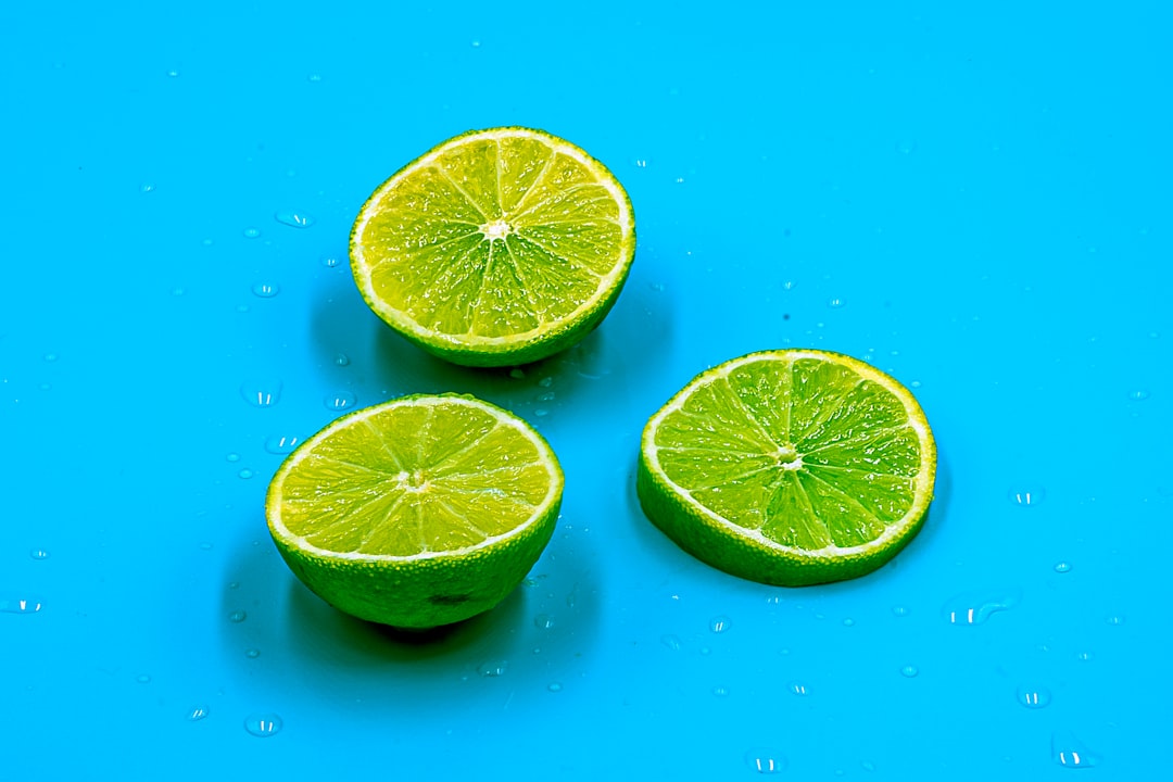 sliced lemon on blue surface