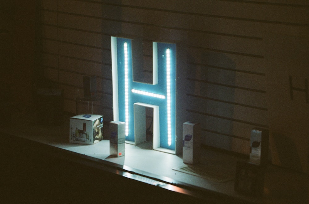 white and blue lighted letter m