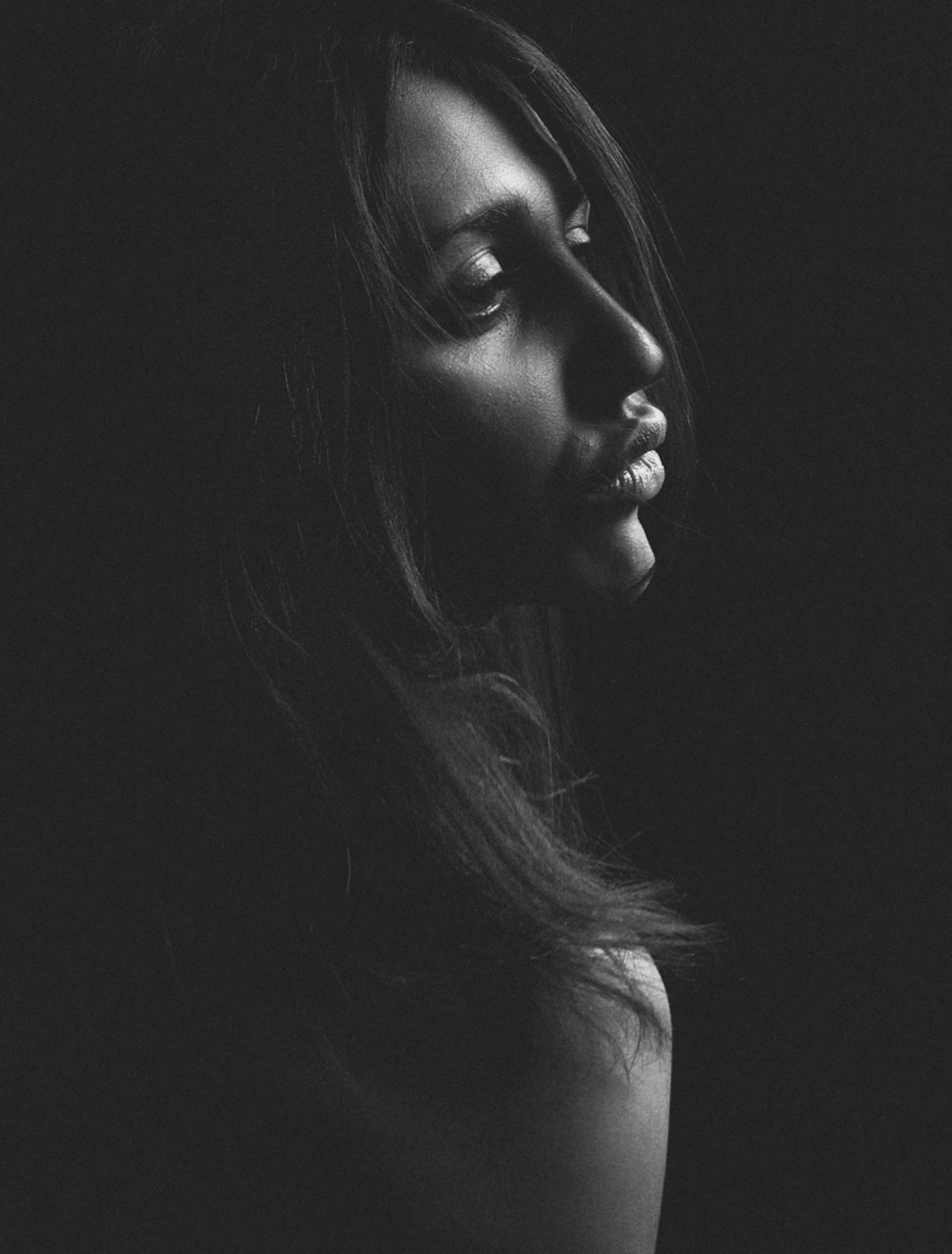 grayscale photo of womans face