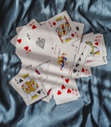 playing cards on blue textile
